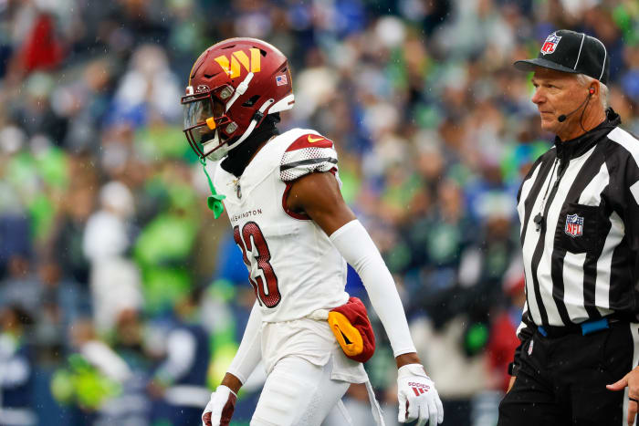Washington Commanders cornerback Emmanuel Forbes (13) reacts after being ejected for a personal foul during the first quarter at Lumen Field.